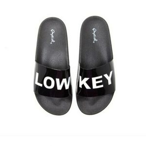 Black Patent #LOWKEY slides...Bold Statemeny